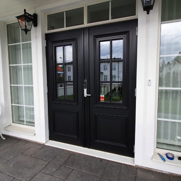 Stylish dark front door of modern house