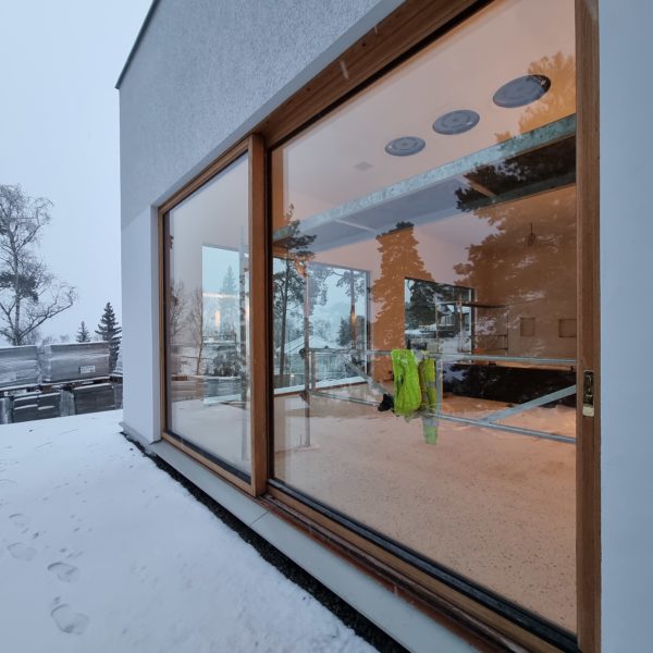 an empty room with winter landscape in window